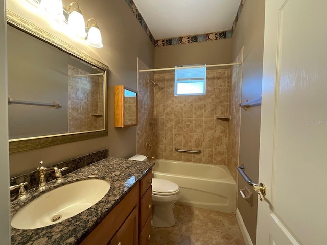 full bath with toilet, tile patterned flooring, washtub / shower combination, and vanity