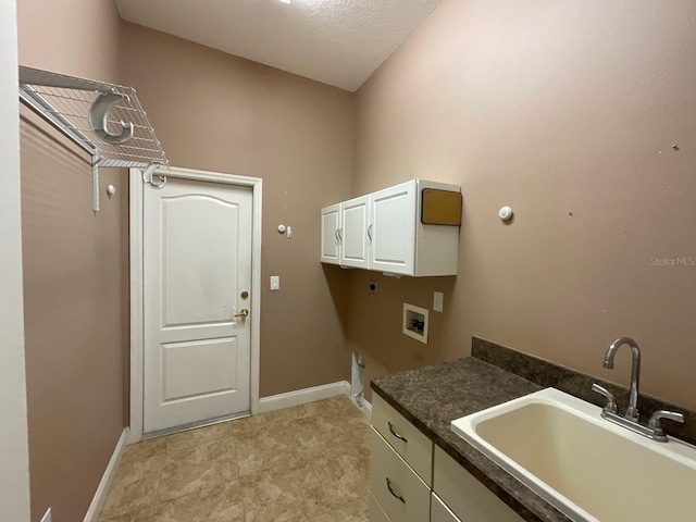 laundry room with washer hookup, a sink, baseboards, cabinet space, and electric dryer hookup