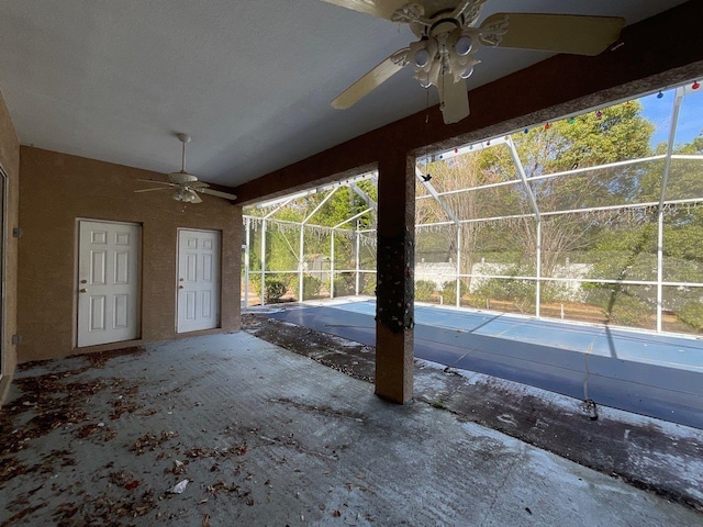 view of patio / terrace featuring a lanai and ceiling fan