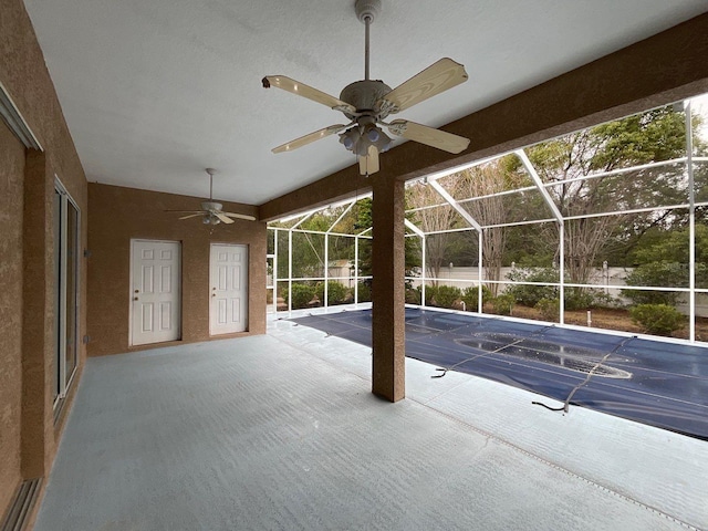 view of patio / terrace with a lanai and ceiling fan