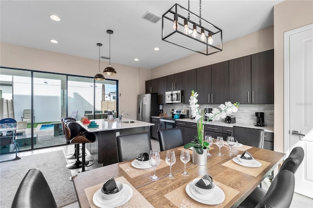 dining space featuring sink