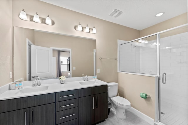 bathroom featuring walk in shower, vanity, and toilet