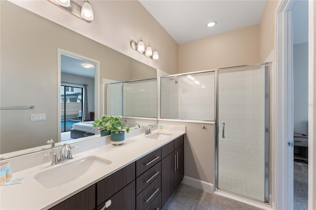 bathroom with vanity, tile patterned floors, and walk in shower