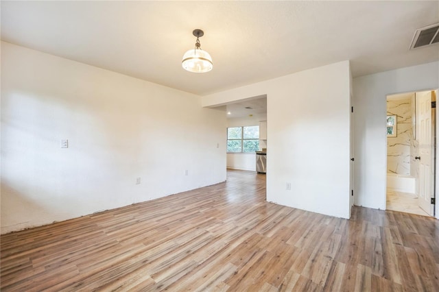 unfurnished room featuring light wood-type flooring