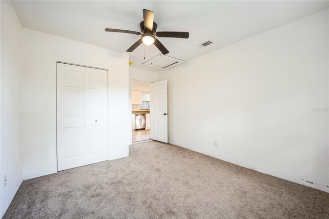 unfurnished bedroom with ceiling fan, carpet flooring, and a closet