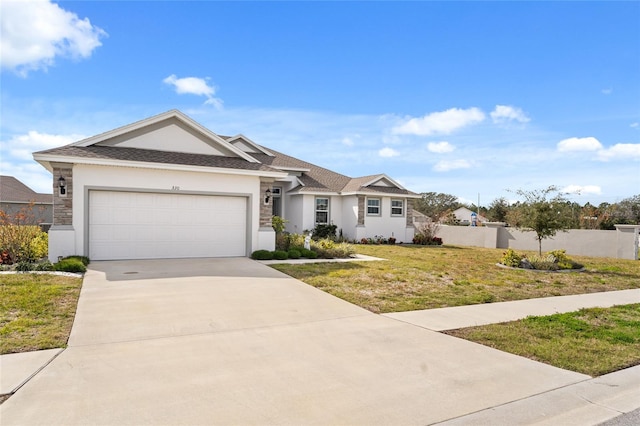 view of front of property with a garage and a front yard