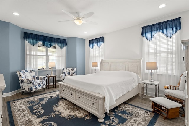 bedroom with hardwood / wood-style flooring and ceiling fan