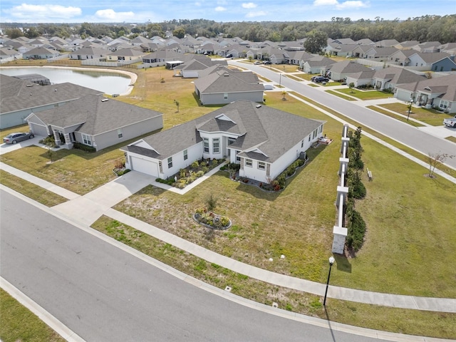 birds eye view of property with a residential view