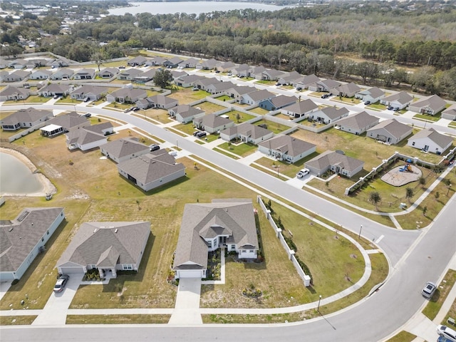 aerial view with a residential view and a water view