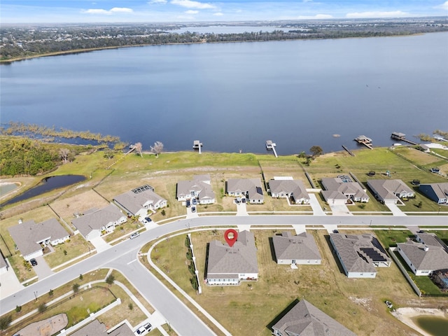 bird's eye view with a residential view and a water view