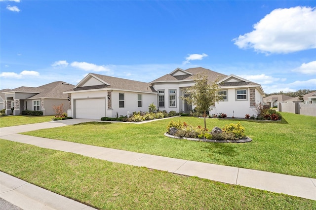 view of front facade with an attached garage, concrete driveway, stucco siding, a front lawn, and roof with shingles