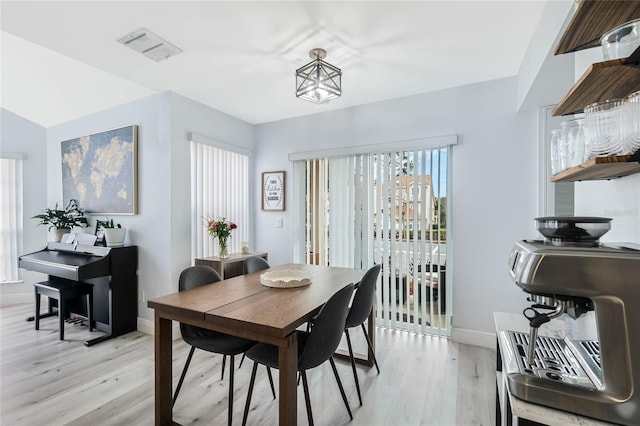 dining space featuring light wood-type flooring