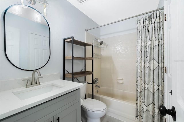 full bathroom featuring vanity, toilet, and shower / bath combo with shower curtain