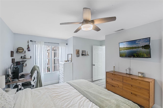 bedroom with ceiling fan and light hardwood / wood-style floors