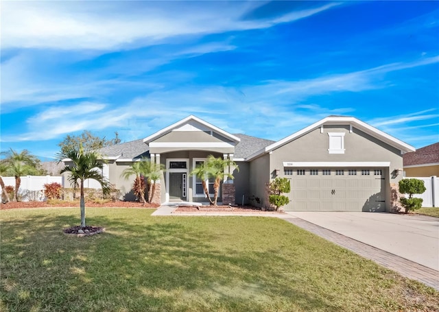 view of front of house with a garage and a front yard