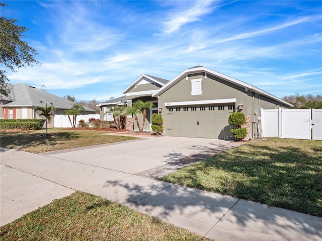 view of front of property with a garage and a front lawn