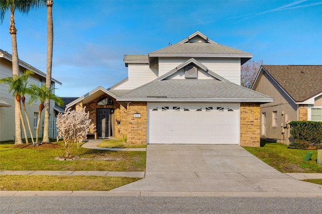 view of front of house featuring a garage and a front yard