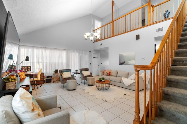 living room with lofted ceiling, light tile patterned floors, and an inviting chandelier