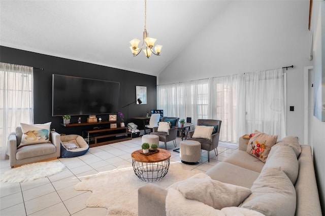 living room with light tile patterned floors, a notable chandelier, and high vaulted ceiling