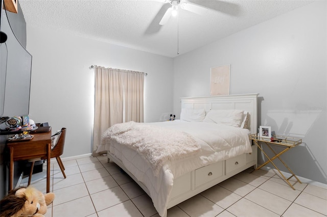 bedroom featuring light tile patterned floors, a textured ceiling, and ceiling fan