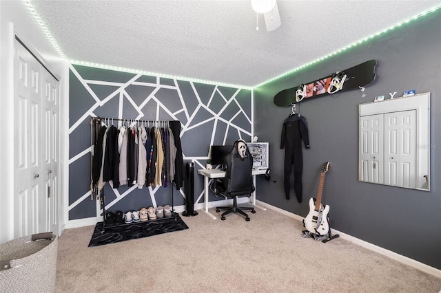 office featuring carpet floors and a textured ceiling