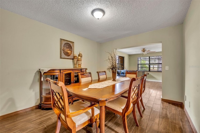 dining space with a textured ceiling