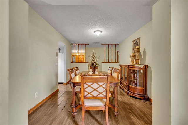 dining room featuring a textured ceiling