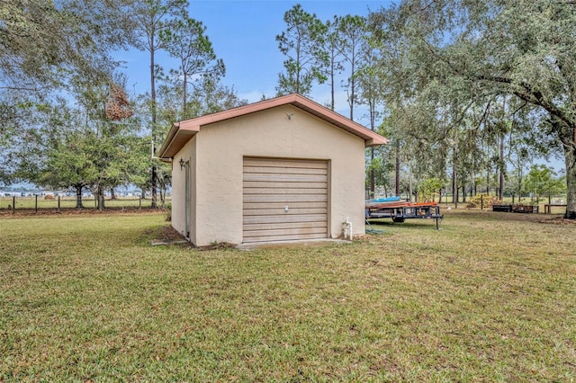 garage featuring a lawn