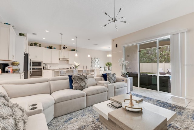 tiled living room with a chandelier