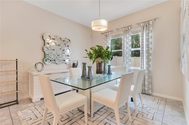 dining space featuring light tile patterned floors