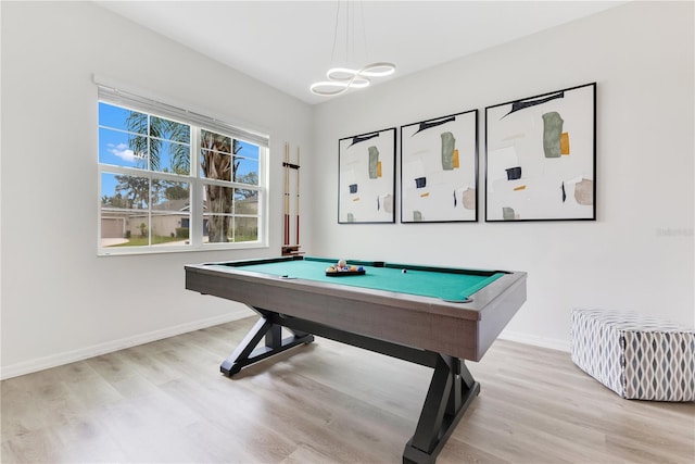 recreation room with pool table and light hardwood / wood-style floors