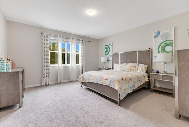 bedroom with light colored carpet