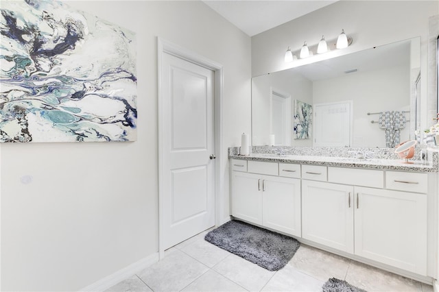 bathroom with tile patterned floors and vanity