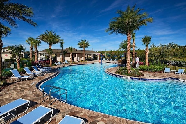 view of swimming pool featuring a patio area