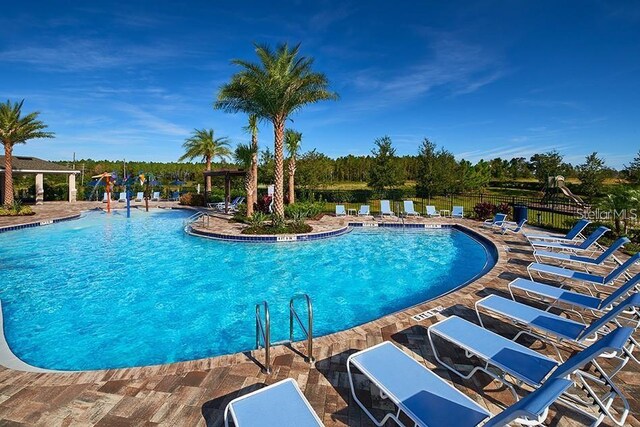 view of swimming pool featuring a patio