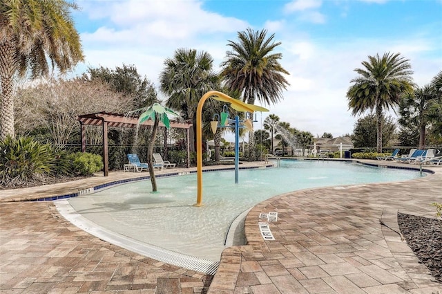 view of pool featuring pool water feature and a pergola