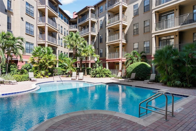 view of swimming pool with a patio area