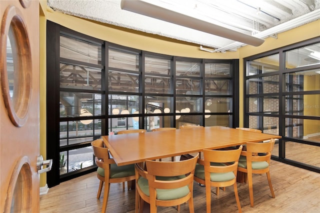 dining area featuring wood-type flooring