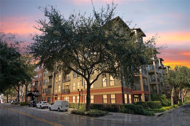 view of outdoor building at dusk