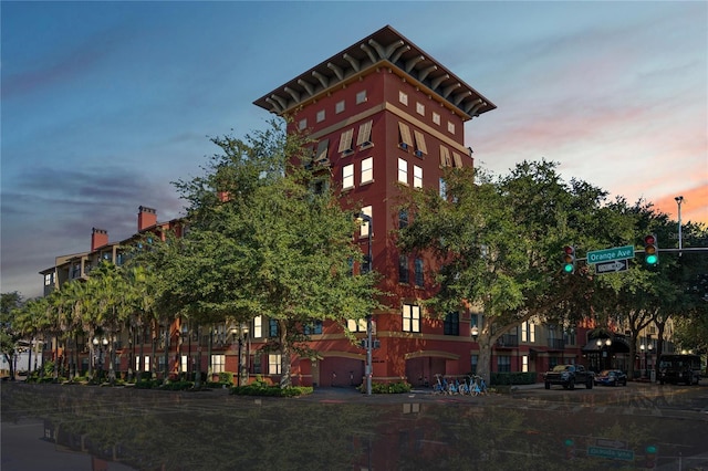 view of outdoor building at dusk