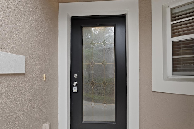 980 Crestwood Commons Ave, Ocoee, FL 34761 - property entrance with stucco siding