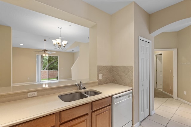980 Crestwood Commons Ave, Ocoee, FL 34761 - kitchen featuring dishwasher, a sink, light tile patterned flooring, a chandelier, and light countertops