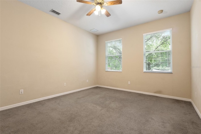 980 Crestwood Commons Ave, Ocoee, FL 34761 - empty room with dark colored carpet, baseboards, ceiling fan, and a smoke detector