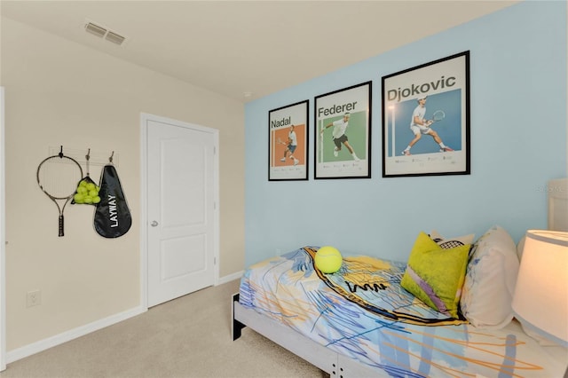 bedroom featuring light colored carpet