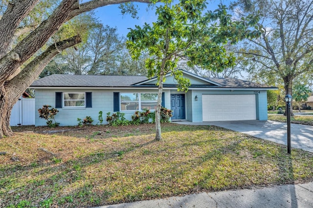 single story home with a garage and a front yard