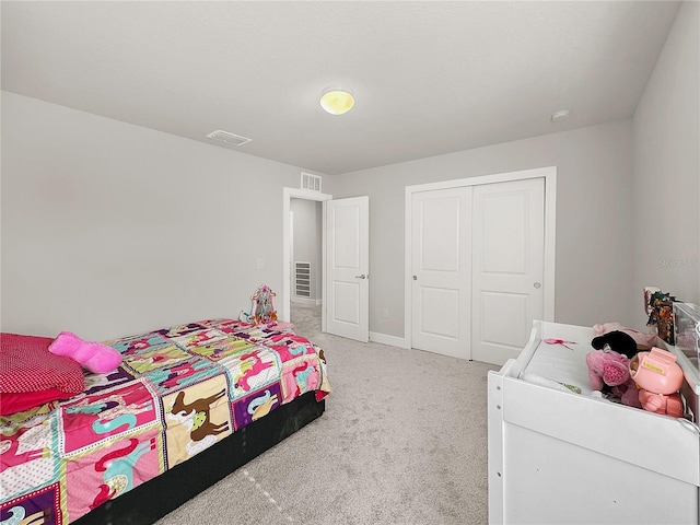 bedroom with carpet floors and a closet