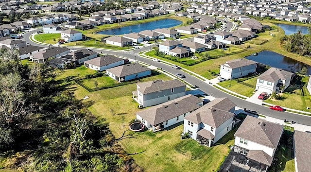 bird's eye view with a water view