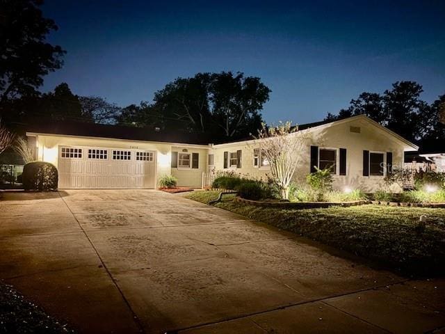 ranch-style home featuring a garage