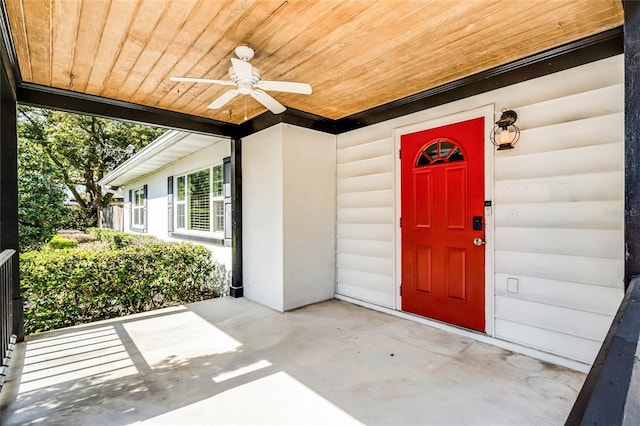 property entrance with a patio and ceiling fan