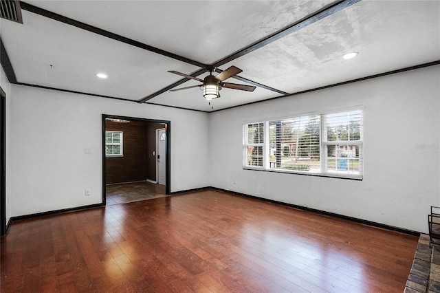 unfurnished room featuring dark wood-type flooring, ceiling fan, and a wealth of natural light